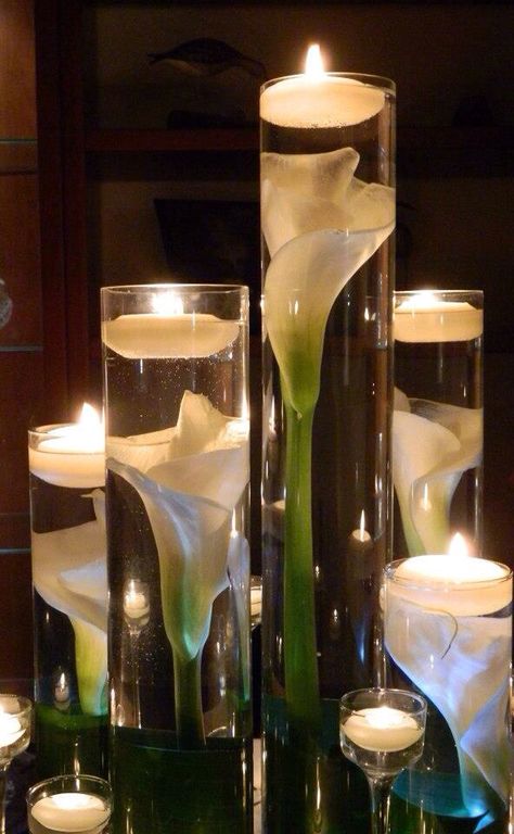 Calla Lillies submerged in cylinder vases with floating candles   I love how they appear magnified. Calla Lillies Centerpieces, Candles And Flowers, Flowers And Candles, Rustic Wedding Decorations, Budget Friendly Wedding, Deco Floral, Floating Candles, Glass Vases, Centre Pieces