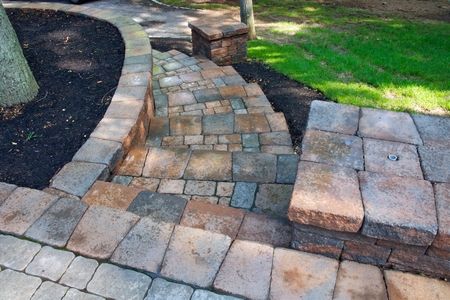 Setting paver steps into a hillside is one way to turn a slope into a usable walkway that is both attractive and convenient. Stone or brick pavers require no mortar when properly set, so the labor required to install them is considerably less than pouring concrete. That is not to say there is no labor involved, because there is, but the bulk of it consists of digging out level terraces for the pavers. Pavers Over Concrete, Outdoor Patio Pavers, Paver Steps, Pavers Diy, Custom Water Feature, Landscape Stairs, Landscape Steps, How To Install Pavers, Summer Cleaning