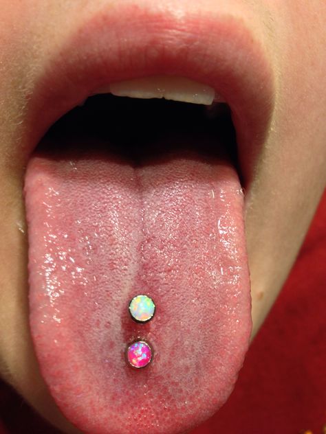 Double tongue piercing with the beautiful opals from Industrial Strength. Tongue Piercings Ideas, Vertical Scoop Tongue Piercing, Tongue Piercing Double, 2 Tongue Piercing, Double Tounge Piercings, Diamond Tongue Piercing, Two Tongue Piercings, Double Tongue Piercing Vertical, Multiple Tongue Piercings