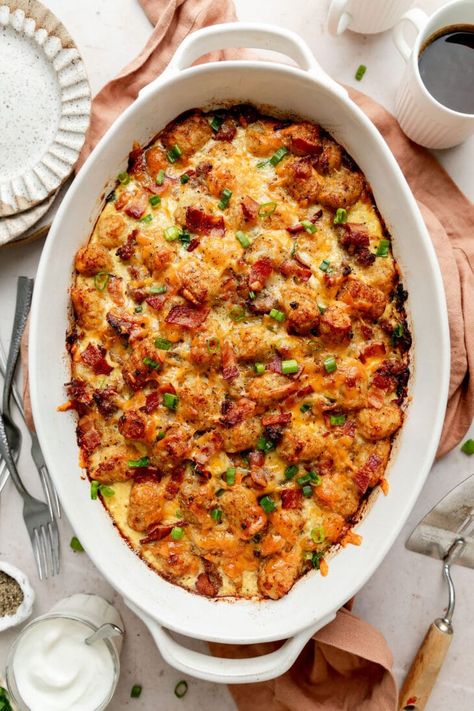 What’s better than one great casserole? It’s two great casseroles in one easy recipe! Think of this Tater Tot Breakfast Casserole as a marriage between classic Tater Tot Casserole and a Make-Ahead Breakfast Casserole. Frozen tater tots, breakfast sausage and bacon, eggs, veggies, cheese, and simple seasonings are all you need to make this satisfying breakfast recipe that’s perfect for hosting guests, brunch, holiday mornings, and nourishing weekday starters. Small Batch Breakfast Casserole, Breakfast Tatertot Casserole Recipe Easy, Small Breakfast Casserole, Tater Tots Breakfast, Tater Tot Breakfast Casserole Sausage Pioneer Woman, Pioneer Woman Breakfast Casserole Tater Tots, Tatertots Casserole Breakfast, Tater Tot Breakfast Casserole Vegetarian, Tator Tot Breakfast