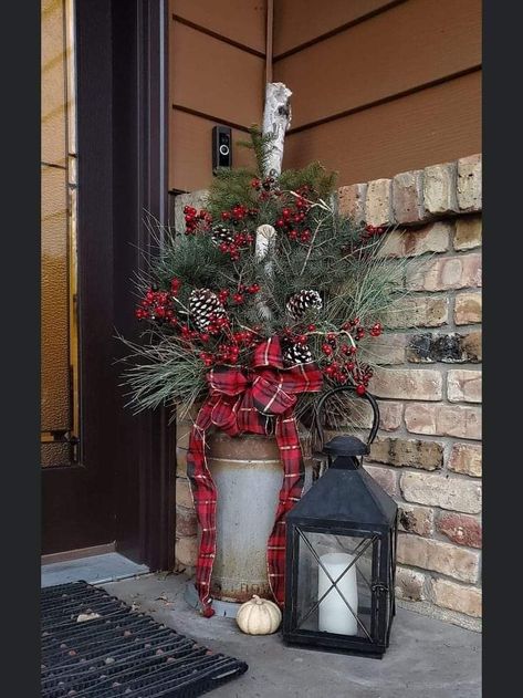 Porch Urns Christmas, Pine Boughs Decorations Front Porches, Milk Can Ideas Front Porches Christmas, Winter Porch Pots Diy, Christmas Outdoor Planter Ideas, Christmas Urns Front Porch, Christmas Porch Decorating Ideas Rustic, Front Porch Christmas Decor Ideas Rustic, Christmas Porch Pots