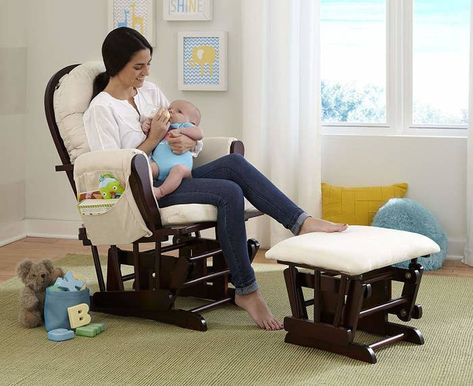 A glider chair with padded arm cushions, two side pouches for reachable storage, and a stool (that'll also glide) to rest your feet. Breastfeeding Chair, Nursery Glider Chair, Baby Glider, Glider And Ottoman, Rocking Chair Cushions, Wood Rocking Chair, Nursery Glider, Nursing Chair, Rocking Chair Nursery