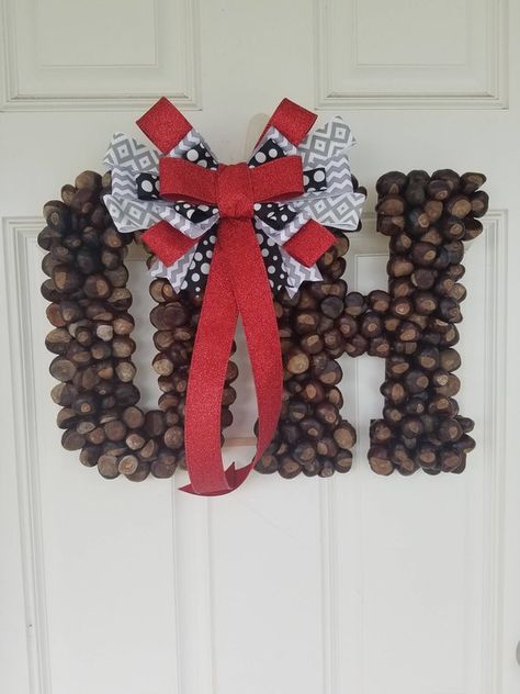 Here is a Ohio State Buckeye wreath for any Ohio State Fan! It is made with real buckeyes hand picked from Ohio. This wreath is a one of a kind and can not be found anywhere else! There is a place to hang it on the back. ***I do not recommend hanging wreath in direct sunlight, leaving Buckeye Projects, Buckeye Wreath, Ohio State Buckeyes Crafts, Ohio State Wreath, Ohio State Crafts, Buckeye Crafts, Wreath Business, Buckeye Nut, Ohio Buckeyes