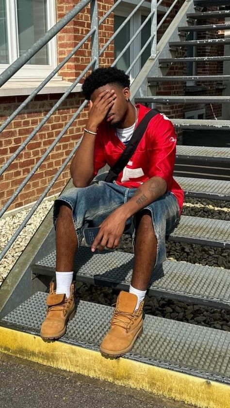 Urban Cool: Vintage Denim Shorts & Bold Jersey Timberland Streetwear Outfit, Fits With Timberlands Men, How To Style Timberland Boots Men, Timberland Outfits For Guys, Outfit With Timberlands, Timberlands Outfit Men, Nba Fashion Outfits, Outfits With Timberland Boots, Basketball Outfits Men