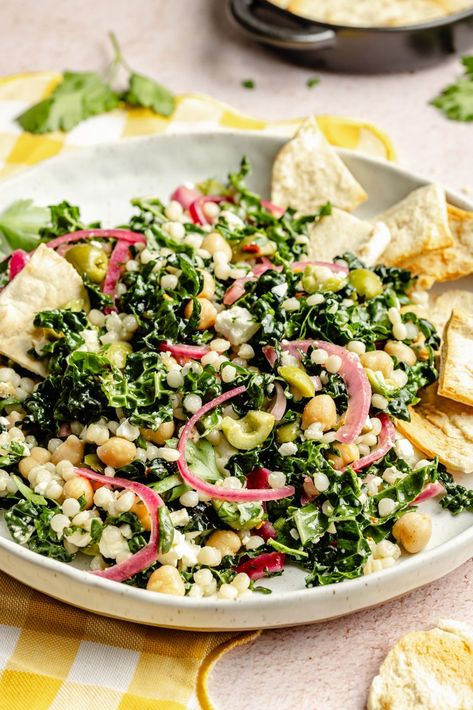 Fresh, herby kale couscous salad with feta, chickpeas, and olives that comes together in just 30 minutes for a satisfying lunch or side dish. Scoop up this beautiful salad with tortilla chips or pitas chips to get an extra delicious crunch! You'll love this veggie-packed salad as is or with your favorite grilled proteins. Kale Couscous, Weekday Meal Prep, Corn And Zucchini, Packed Salad, Best Summer Salads, Lemon Garlic Salmon, Salad With Feta, Recipes To Cook, Ambitious Kitchen