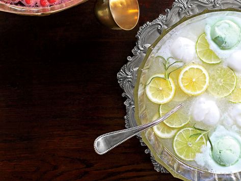 Lemon-Lime-Rosemary Punch | Every baby shower and holiday party in the South will welcome a festive punch bowl with mounds of sherbet floating on top. Put a fragrant spin on this classic citrus punch for a refreshing, tart, herb-infused beverage. Easter Punch Recipes, Easter Punch, Christmas Mocktail, Party Punch Alcohol, Spring Feast, Shower Punch, Party Beverages, Shower Checklist, Holiday Punch Recipe