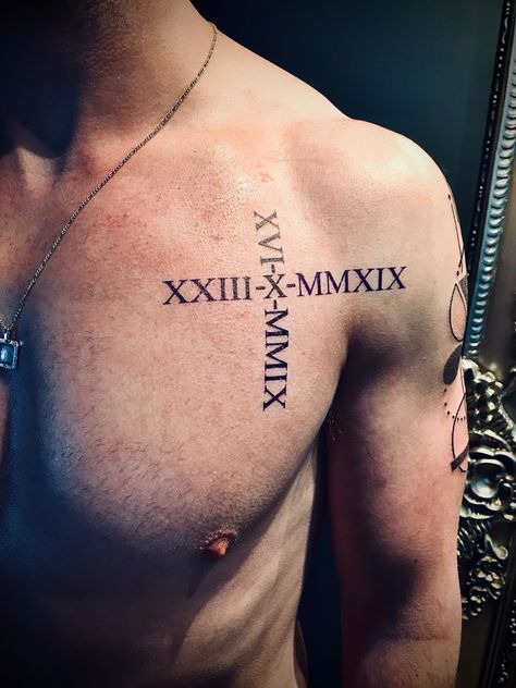 Mens chest tattoo numeral Date Tattoos Men, Roman Numeral Tattoo Men Chest, Chest Tattoo Roman Numerals, Chest Tattoo Family, Roman Numeral Birthday Tattoo, Mens Chest Tattoo, Roman Numeral Tattoo Men, Tattoo Roman Numeral, Roman Numbers Tattoo