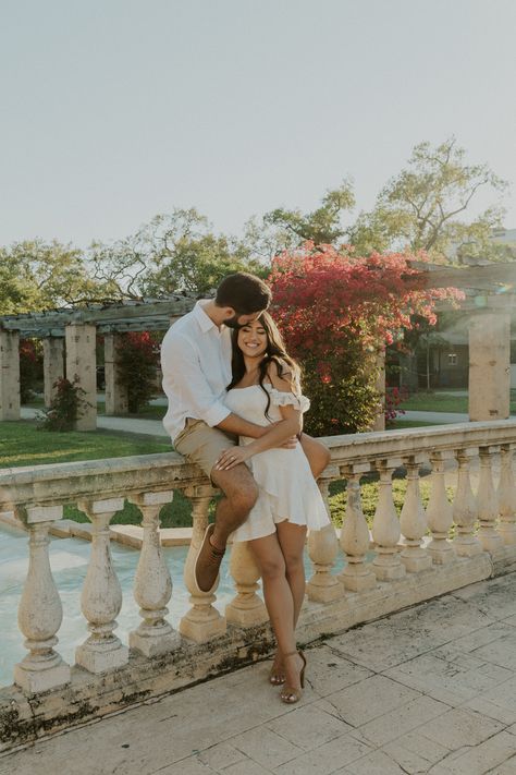 Coral Gables Entrance Park is a hidden gem in Miami, Florida, offering a beautiful and peaceful escape from the hustle and bustle of the city. The park features a stunning entrance with a fountain, arches, and lush greenery and bougainvillea plants that make for the perfect backdrop for your photoshoot. . Coral Gables Photoshoot, Wedding Park Photos, Romantic Garden Engagement Photos, Longwood Gardens Engagement Photos, Filoli Gardens Photoshoot, Garden Engagement Photoshoot, Couple Garden Photoshoot, Botanical Garden Engagement Shoot, Greenery Photoshoot