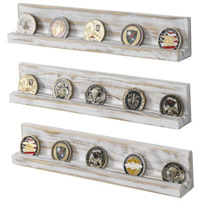 Elevate the presentation of your coin or medallion collection with this set of 3 decorative whitewashed wooden floating racks. Each shelf features a groove that securely holds small plaques, making it ideal for displaying honorary awards alongside corresponding coins or medals. These coin holder shelves are perfect for showcasing commemorative medals or pins for military service members, veterans, and challenge coins for law enforcement personnel, police officers, and firefighters. Crafted from Challenge Coin Display Diy, Closet Boxes, Challenge Coin Holder, Metal Floating Shelves, Trophy Display, Military Coins, Wood Floating Shelf, Whitewashed Wood, Coin Display