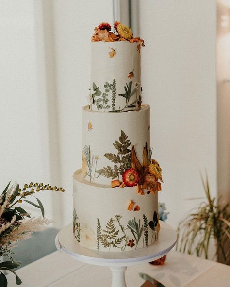 Bright orange, yellow and green pressed flowers on a white buttercream cake. Wildflower Wedding Cake, Red Rocks Wedding, Pressed Flower Wedding, Red Rock Wedding, Orange Wedding Cake, Sedona Elopement, Green Wedding Cake, Boho Wedding Cake, Earthy Wedding