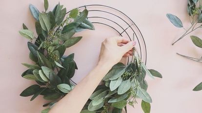 Decorate your home for every season with this simple DIY wreath. The artificial eucalyptus base is timeless and with the addition of seasonal silk flowers you can update your door decor throughout the year with this one handmade wreath. Step 1: Start by attaching the artificial eucalyptus (or any of your favorite faux greenery sprays) to the wire wreath form using floral tape. Step 2: Continue adding the greenery until the wire form is thoroughly covered. Step 3:… Wreath Making Party, Diy Floral Wreath, Silk Flower Wreaths, Fake Flower Arrangements, Make A Wreath, Wire Wreath Forms, Homeschool Crafts, Wire Wreath Frame, Flower Wreaths