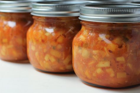 Peach Salsa has it all - sweet and tangy fruitiness with a spicy, fiery kick. Set your tastebuds dancing. Great for dipping, or on grilled meat or fish. Canning recipe has a special process to keep the peach texture intact without cooking to mush. Peach Habanero Salsa Canning, Peach Salsa Recipe Canning, Spicy Peach Salsa, Salsa Recipe For Canning, Zucchini Salsa, Salsa Canning Recipes, Peach Salsa Recipes, Homemade Dressings, Habanero Salsa