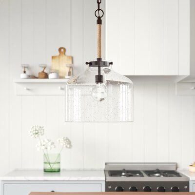 Seeded glass and rope accents combine in this single pendant to create a coastal farmhouse look above your kitchen island or dining table. It has a seeded glass dome shade that complements the metallic finish and rope-wrapped-down rod. A single 100W bulb (not included) washes your space in just the right amount of glow. This fixture is compatible with a dimmer switch to effortlessly take you from morning to night. Plus, it hangs from an adjustable chain and has a sloped ceiling-compatible canopy Wayfair Furniture, Nursery Furniture Sets, Teen Bedding, Kitchen Island Pendants, Coastal Farmhouse, Seeded Glass, Beachcrest Home, Glass Dome, Menu Furniture