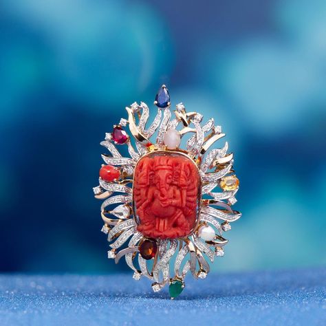 An ode to the remover of obstacles, this #EveningApala brooch features a red coral Ganesha in an auspicious nine-gem (Navaratna) setting.… Coral Finger Ring, Pearl Necklace Tutorial, Navaratna Jewellery, Ganesh Pendant, Coral Jewellery, Diamond Pendent, Coral Pendant, Necklace Tutorial, Coral Jewelry