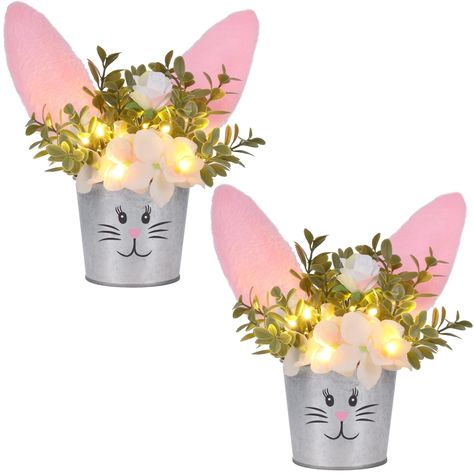 PRICES MAY VARY. Easter Table Decor: Our bunny artificial flower tabletop centerpiece is a nice addition to your Easter home decor. The plant pot is designed as a rabbit with plush bunny ears on the top, looks adorable and distinctive. Realistic Flowers: The flowers and leaves are lifelike and realistic, display the artificial flower in your home will make you feel closer to nature or Spring, it will add a perfect touch to your parties. LED Lights: There are several LED lights among the flowers, Little Christmas Trees, Decorations For Home, Easter Bunny Decorations, Spring Party, Easter Table Decorations, Bunny Ears, Easter Table, Easter Party, Bunny Ear