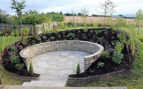 A paved, walled sunken garden behind an earth bank to enjoy the sun when things get too windy on the decking.   | Sunken circle Windy Garden Ideas, Sunken Garden Ideas, Recessed Patio, Circle Garden Design, Sloped Backyard Landscaping Ideas, Garden Circle, Steep Gardens, Sloped Backyard Landscaping, Garden Seating Area