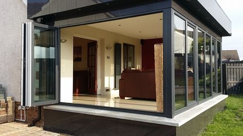 Great Britain-based Budget Conservatories—while adding a certain sophistication to their word for sunroom—call this modern addition a Prefab Sunroom, Contemporary Sunroom, Sunroom Extension, Modern Sunroom, Sunroom Kits, Small Sunroom, Accordion Doors, Fold Door, Alternative Living