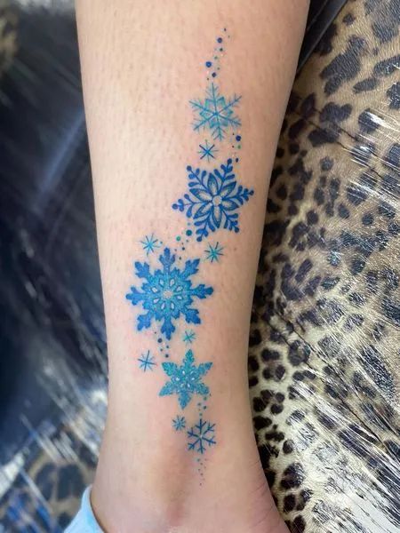 Blue Snowflake Tattoo Blue Snowflake Tattoo, Small Snowflake Tattoo, Tattoo Ideas And Meanings, Snowflake Tattoos, Snowflake Tattoo, Snow Tattoo, Stained Glass Tattoo, Snow Flake Tattoo, Feminine Symbols