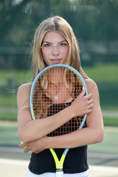 A high school senior, tennis player,  hugs her racquet in a close up portrait. Tennis Banner Poses, Tennis Senior Picture Ideas, Tennis Media Day Poses, Tennis Senior Photos, Tennis Poses Photo Ideas, Tennis Pictures Poses, Tennis Portraits, Tennis Photoshoot Ideas, Tennis Poses