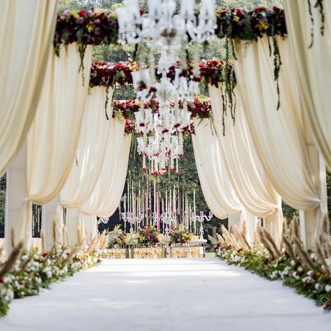 Enter a realm of timeless elegance with our white-themed decoration at the entrance, where simplicity meets sophistication. The pristine white decor elements create a serene and inviting atmosphere, setting the tone for a memorable celebration. From cascading floral arrangements to delicate drapery and soft lighting, every detail is meticulously designed to enchant and captivate. As you step through this elegantly adorned entrance, you embark on a journey into a world of beauty and romance, m... Wedding Passage, Reception Entry, Entry Arch, Nikkah Decor, Wedding Walkway, Wedding Entry, Indian Wedding Theme, Events Decorations, Wedding Lunch