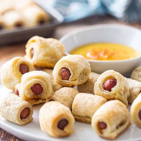 Pigs in a Blanket: Mini hot dogs wrapped in an easy homemade puff pastry. So flaky and buttery, with a sweet & tangy honey mustard dipping sauce. Perfect party app! #pigsinablanket #crescentrolls #recipe #easy #foracrowd #withhotdogs #puffpastry #dippingsauce #mini #christmas #sides #sausage #grownup #forkids #howtomake #dinner #fancy #homemade #fromscratch #babyshowerfood #halloween #football #meal #pizzadough #holiday #appetizer #gourmet #best #party #sauce #withchili #platter #hotdogs #thanks Pigs In A Blanket Puff Pastry, Easy Homemade Puff Pastry, Pigs In A Blanket Recipe, Homemade Puff Pastry, Easy Puff Pastry Recipe, Mini Hot Dogs, Honey Mustard Dipping Sauce, Mustard Dipping Sauce, Easy Puff Pastry