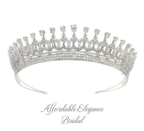 Radiant CZ Crystal Bridal Tiara Add a regal touch to your special day with this gorgeous cz tiara crown. This beautiful silver plated headpiece features high quality teardrop, marquise and oval cut cz crystals artistically arranged in a majestic 2" design. Color: Silver. Style: hp9887. Size: Design is about 2" high at its center peak. Please allow 2-3 weeks for delivery. Shipping Policy . Return Policy Beaded Edge Veil, Quinceanera Accessories, Bridgerton Wedding, Winter Wedding Accessories, Gold Bridesmaid Jewelry, Beaded Wedding Veils, Quinceanera Tiaras, Fingertip Wedding Veils, Rose Gold Tiara