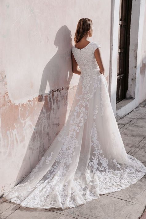 With a full skirt and cap sleeves, this lace gown is completely timeless | wedding inspo, classic wedding aesthetic, classic modern wedding, modern wedding, classic modern wedding dress, designer wedding dresses, romantic wedding gown, A-line wedding dress, timeless wedding dress, glam wedding dress, lace wedding dress, tulle wedding dress, dark romantic wedding, romantic wedding, christmas wedding, winter wedding, simple wedding dress, wedding dress back, lace wedding gown, a-line wedding dress Cap Sleeve Wedding Dress, Mormon Wedding, Wedding Dress Back, Wedding Dresses Modest, Wedding Dress Backs, S Wedding Dress, Old New Borrowed Blue, Timeless Wedding Dress, Lace Wedding Gown