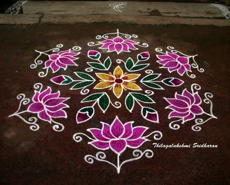 This is a dotted lotus kolam with 15-8 interlaced dots Colour Kolam, Lotus Kolam, Lotus Rangoli With Dots, Dots Rangoli With Colors, Lotus Rangoli Designs, Dot Rangoli With Colour, Dots Rangoli, Kolam Dots, Indian Rangoli Designs