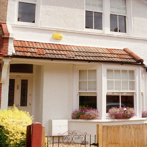 Exterior | Stylish white terrace | House tour | Ideal Home | PHOTO GALLERY 1930 House Exterior, 1930s House Exterior Uk, Terraced House Front Garden, White Terrace, Victorian Front Porch, 1930s House Exterior, Terrace House Exterior, Front Doors Uk, Ideal Home Magazine