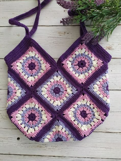 knitted a crochet bag and a Granny Square Bag, it is a weekend bag for women.

Combination of purple harmonious colors. I knitted this motif bag with great love. 💖

You will add elegance to your clothes with this small bag that you will love to use in summer.
It is a light bag that you can easily use on weekends. Big Granny Square Pattern, Big Granny Square, Ideas A Crochet, Crochet Granny Square Bag, Festival Purse, Handbag Big, Crochet Sweater Design, Purple Tote Bag, Handbags Design