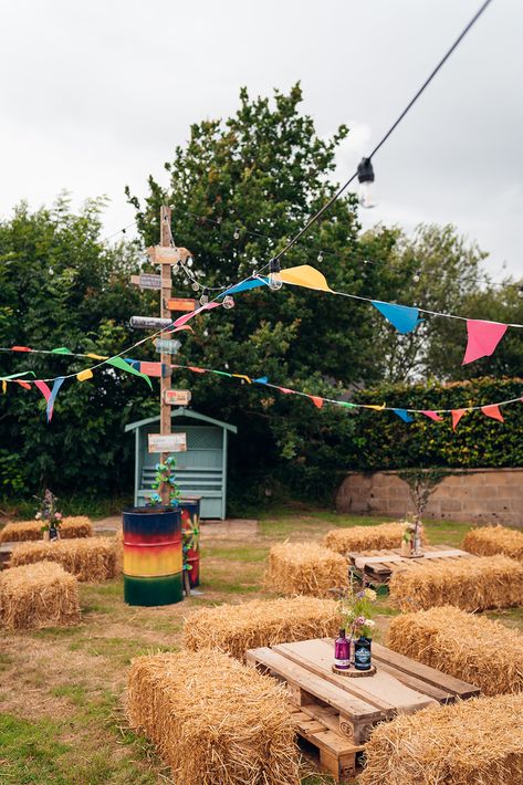 Outdoor Wedding Reception In A Field - Colourful Wedding Party Sign - Tipi Wedding In A Field - Unconventional Wedding - Festival Wedding Inspiration - Multi-coloured Bunting - Haybales For Seating - Wedding Field Festival Wedding Food Ideas, Festival Wedding Table Decorations, Summer Festival Decorations, Summer Festival Ideas, Music Festival Wedding Ideas, Festival Photo Booth Ideas, Festival Inspired Wedding, Festival Wedding Theme, Diy Festival Ideas