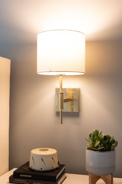 Want to add some brass sconces to your bedroom? Here are my best tips to choose sconces, plus how how high to place them over your nightstand. #sconces #brass #sconce Wall Sconces Above Nightstand, Scones In Bedroom, Gold Wall Sconces Bedroom, Wall Scones In Bedroom, Bedside Sconces Wall Mount Bedroom, Nightstand Sconces, Bedside Sconces Wall Mount Placement, Bedroom With Sconces, Bedroom With Wall Sconces