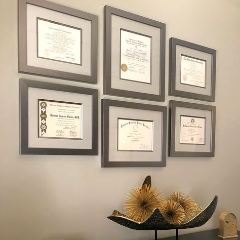 Does your office wall need a spruce-up, a custom arrangement, or a new design? Let us help you with all three! We'd love to make your distinguished documents look as priceless as they are. Photo Frame Arrangement On Wall, Frame Arrangement On Wall, Photo Frame Arrangement, 3 Photo Frame, Diploma Display, Frame Arrangement, Wall Groupings, Frames Wall, Photography Backgrounds