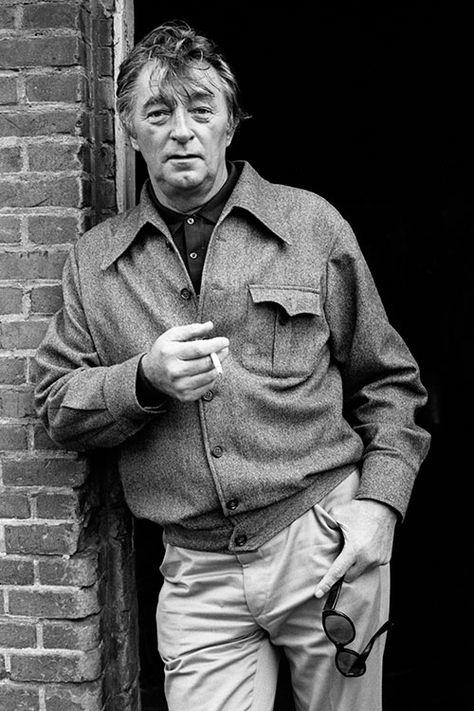 Actor Robert Mitchum (1917 – 1997) leaning at a wall of a barn in Holland, during the shooting of ‘The Amsterdam Kill’, 1977. Robert Mitchum, Terry O Neill, Tiger Beat, Hollywood Men, Private Eye, Hollywood Actors, Film Stars, Actors Images, Tough Guy