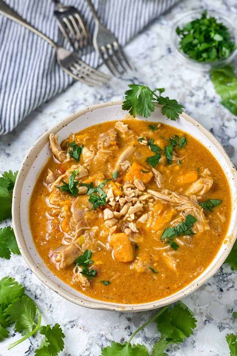 African Peanut Chicken Stew Recipe: Chicken and sweet potatoes simmered in creamy peanut butter broth with garlic, ginger and a kick of cayenne. Wow is this delicious! #GlutenFree #DairyFree #PeanutStew #ChickenStew #AfricanPeanutStew Liberian Culture, West African Peanut Stew, Stew With Chicken, Chicken And Sweet Potatoes, Peanut Butter Curry, African Peanut Soup, African Peanut Stew, Spicy Stew, Liberian Food