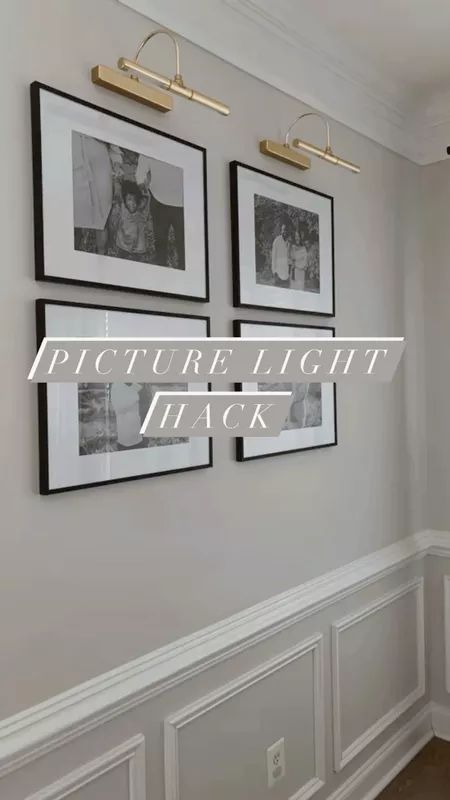 Hallway Pictures With Picture Lights, Picture Light Over Photo Gallery, Light Over Gallery Wall, Frame With Lights And Pictures, Wall Lights Over Photos, Lights Above Picture Wall, Wall Gallery With Lights, Photo Frame Wall With Lights, Best Picture Frames Wall Galleries