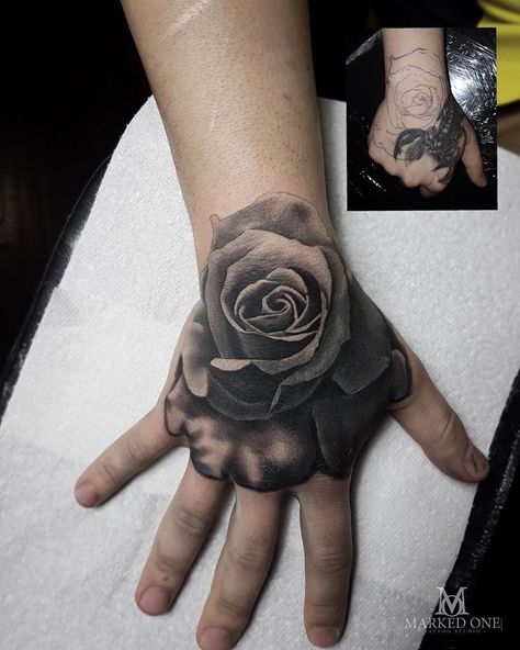 Black and grey hand tattoo.  Rose tattoo cover up by Gav Guest of Marked One Tattoo. Mens Rose Hand Tattoo, Rose And Bones Hand Tattoo, Black Rose On Hand Tattoo, Men’s Hand Tattoos Rose, Black Rose Hand Tattoo, Rose Tattoo Cover Up, Hand Tattoo Cover Up, Side Hand Tattoos, Rose Hand Tattoo