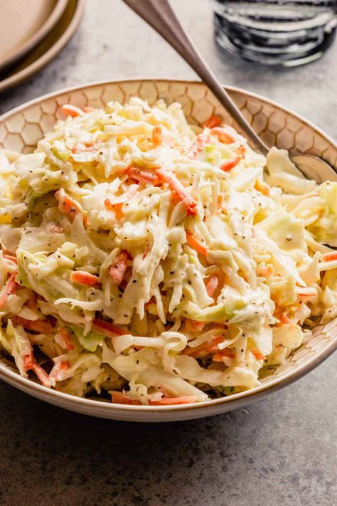 A bowl of creamy coleslaw with a silver spoon on a grey counter. Mexican Coleslaw Recipe, Creamy Coleslaw Recipe, Homemade Coleslaw Dressing, Mexican Coleslaw, Creamy Coleslaw Dressing, Classic Coleslaw Recipe, Coleslaw Dressing Recipe, Easy Coleslaw, Coleslaw Recipe Easy