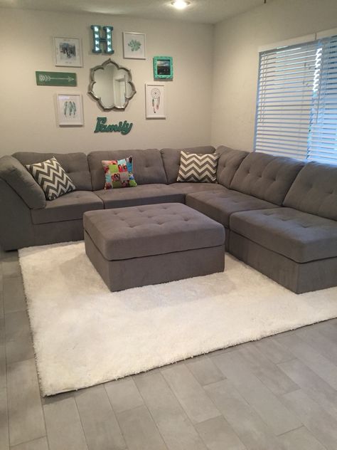 Gray sectional, shag rug, family wall collage Grey Color Sofa Living Room, Nice Sofa Design, Ottamon Decor Ideas, Sectional Couch Small Living Room, Collage Living Room, Gray Sectional Living Room, Grey Sofa Set, Sectional Living Room Sets, Meja Sofa