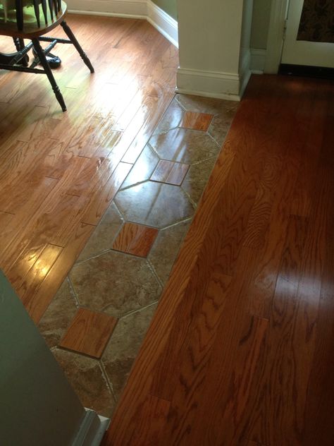 A really cool way to tie two different hardwood lots together. Entryway Tiles, Tile To Wood Transition, Living Room Hardwood Floors, Transition Flooring, Wood Floor Design, Real Hardwood Floors, Floor Remodel, Dark Wood Floors, Flooring Ideas