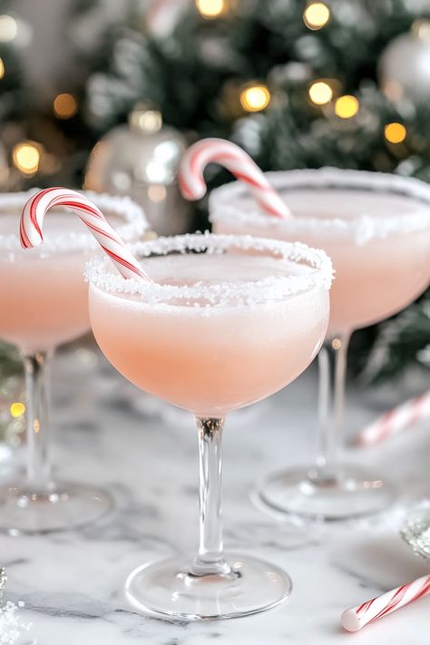 Festive Christmas Peppermint Cocktails Christmas Ball Drink, Cute Holiday Cocktails, Pretty Christmas Drinks, Pink Christmas Cocktail, Christmas Cocktails Aesthetic, Best Christmas Cocktails Recipes, Cute Christmas Cocktails, Christmas Ornament Cocktails, Christmas Prosecco Cocktails