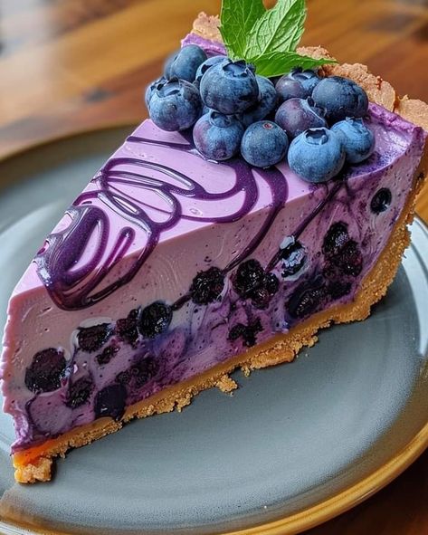 ￼


😋💜🍇  Irresistible Blueberry Dream Cheesecake
Ingredients:
1 1/2 cups graham cracker crumbs
1/2 cup melted butter
2 cups fresh blueberries
3/4 cup sugar
2 tablespoons cornstarch
1 tablespoon lemon juice
3 packages (8 oz each) cream cheese, softened
1 cup sugar
1 teaspoon vanilla extract
3 large eggs
1/2 cup sour cream
Fresh blueberries and mint leaves for garnish
Directions:

Preheat oven to 325°F (165°C). Grease a 9-inch springform pan.
In a medium bowl, mix graham cracker crumbs and melted butter. Press mixture firmly into the bottom of the prepared pan to form a crust.
In a saucepan, combine 2 cups blueberries, 3/4 cup sugar, cornstarch, and lemon juice. Cook over medium heat until the mixture thickens, about 10 minutes. Set aside to cool.
In a large mixing bowl, beat the cream ch No Bake Blueberry Cheesecake, Caramel Apple Cheesecake, 귀여운 음식 그림, Fruity Desserts, Blueberry Cheesecake, Cream Cheese Filling, Graham Cracker Crumbs, Graham Cracker, Finger Food