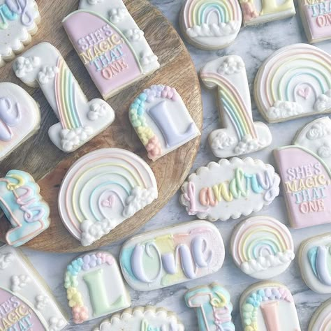 Erica on Instagram: "All the sweet rainbow designs for miracle baby, Landry, on her first birthday! #rainbowcookies #rainbowbabycookies #rainbowbirthday #rainbowbirthdaycookies #firstbirthday #firstbirthdayparty #firstbirthdaycookies #decoratedcookies #royalicingcookies #ohiocookier #ohiobakery #ohiocookies #mamamungaibakes" One Year Rainbow Party, First Birthday Pastel Rainbow Theme, Pastel First Birthday Cookies, One Year Old Rainbow Birthday Party, Rainbow Theme Cookies, Pastel Rainbow Birthday Theme, First Birthday Color Theme, Pastel First Birthday Party Decor, Rainbow First Birthday Theme