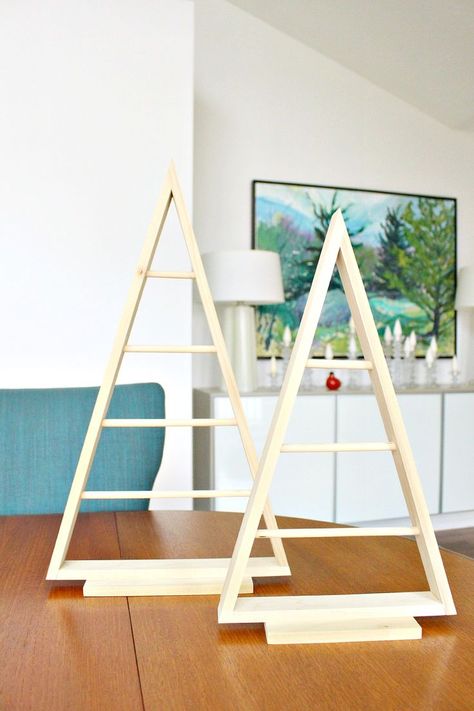 Easy DIY A-frame triangle ornament display tutorial. Looking for ornament display ideas? Check out this Christmas display stand! This DIY ornament display looks great on a credenza or table. Tie ornaments to it, finish it in any color or stain! Great Christmas tree alternative idea! #ornamentdisplay #christmascraft #christmasdiy Modern Christmas Diy, Best Christmas Tree Stand, Wood Christmas Trees Diy, Wooden Christmas Trees Diy, Ornament Tree Display, Wood Christmas Decorations, Christmas Diy Wood, Ornament Stand, Diy Christmas Ornament