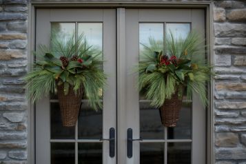 Artificial greenery for front door baskets from @Allison House by JSD .  Must check out this house! Door Baskets, Winter Pots, Front Door Baskets, Wreath Inspiration, Magnolia Leaf, Winter Arrangements, Brown Rooms, Winter Wreaths, Artificial Greenery