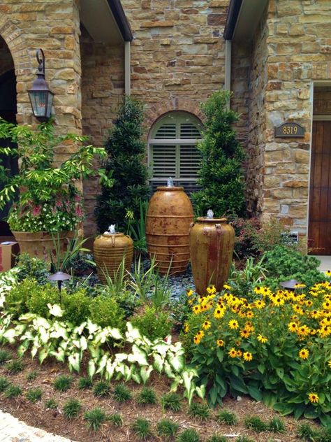 20 Ideas for Using Large Garden Containers | HGTV Tuscan Landscape Design, Mediterranean Landscape Design, Courtyard Landscaping, Tuscan Landscaping, Front Yard Design, Mediterranean Landscaping, Decor Ikea, Rock Garden Landscaping, Front Yard Garden