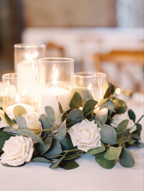 White Roses Dinner Table, Greenery And White Flowers Centerpieces, White Rose Decor Wedding, Eucalyptus And Rose Centerpiece, White Rose Centrepiece, White Rose And Candle Centerpiece, White Rose And Eucalyptus Centerpiece, White Rose Table Centerpiece, Simple White Rose Centerpiece