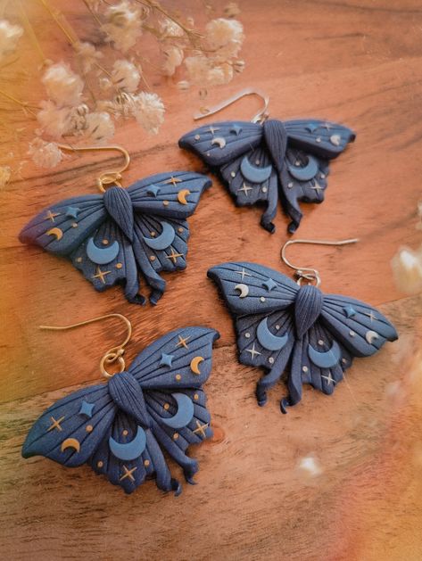 ✨Dark Blue Mystical Moth Earrings | Dark cottagecore witch collection ✨ ⭐MATERIALS USED⭐ - Stainless Steel (tarnish resistant, more resistant than gold plated and safe for sensitive skin) - Polymer Clay (durable, flexible, waterproof and very lightweight) - Handmade Pieces, each piece is carefully shaped, painted, baked, sanded, cleaned and assembled by hands. ⭐REFUND INFORMATION⭐ - This product is not refundable - Please read all specifications before purchasing.  - Exception to refund policy a Goth Polymer Clay Jewelry, Gothic Polymer Clay, Clay Moth, Clay Earring Design Ideas, Polymer Clay Mushroom Earrings, Cottagecore Crafts, Diy Earrings Polymer Clay, Polymer Earrings, Polymer Clay Projects