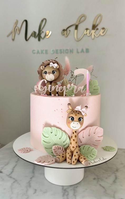 A cake to celebrate two years birthday with Leo and giraffe made of sugar paste.  #CakeArt #CakeDesign #CakeDecor #CakeForChild #BirthdayCake #AnimalsThemeCake Wild One Birthday Cake Pink, Wild Cake Birthday, Pink Safari Birthday Party Cake, Giraffe Smash Cake, Pink Jungle Cake, Two Wild Girl Cake, Wild One Girls 1st Birthday Cake, One Year Cake Girl, Cake For 3 Year Girl