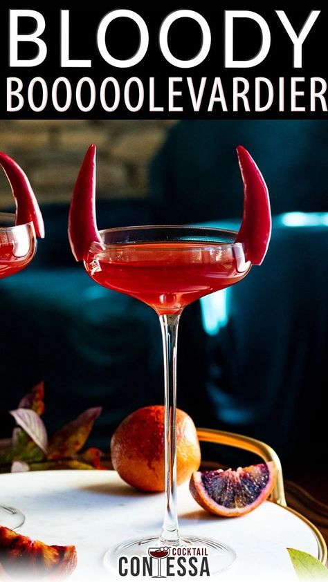 Halloween is the time for bloody and bitter cocktails and this easy Boulevardier riff is perfect as a single cocktail or batched as a Halloween drink. In this cocktail we take a classic Boulevardier, top it with blood orange soda and add a fun pepper garnish to give the whole thing some horns. | @cocktailcontessa #halloweencocktails #diyhalloweencocktailparty #fallcocktailparty #halloweenpartycocktails Orange Alcoholic Drinks, Halloween Whiskey, Fall Cocktail Party, Halloween Drinks Alcohol, Boulevardier, Halloween Drink, Cocktail Decoration, Drink Garnishing, Orange Cocktails